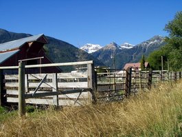 A nearby barn with the Wallowa Mountains in the background