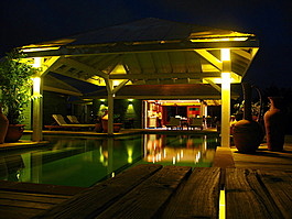 The pool and dining room at night