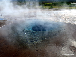 The brilliant blue hole of the Konungshver geyser
