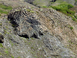 A circular and tilted stack of basalt columns