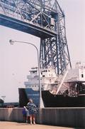 A freighter goes under the bridge