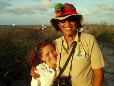 Rosa and Biti with a Christmas iguana hat