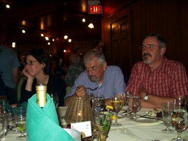 Terry, Albert, and Michael listen to the yarn intently