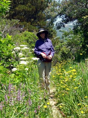 Lori amidst flowers