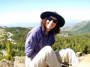 Lori still smiling after scaling Rose Knob Peak