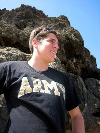 Andrew stands tall against the coral cliffs