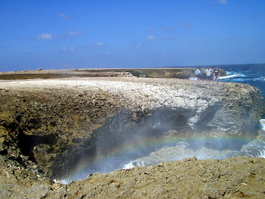 Mist and rainbow, Lori, Steven, and Andrew by the blowhole