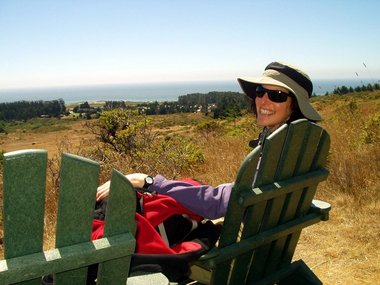 Lori, with the Camp and ocean behind