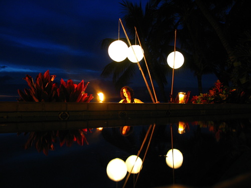 Lori behind the swimming pool