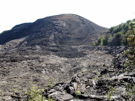 Note the people on the trail below the black lava