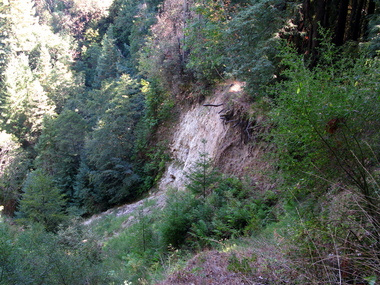 A landslide from the 1995 rains which show the layered beds of alluvial sediments