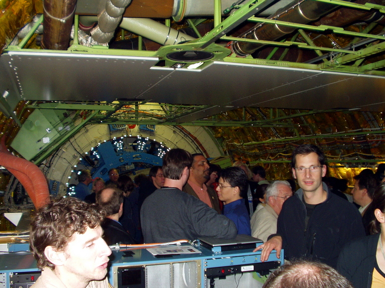 Here is coach seating in this 747. Spartan. Few seats and no trim with exposed wiring, control wires, and ducts. Workstations. Telescope at the rear.  But wow! Seeing the inside of a jet, naked, is quite something. This is a view aft from mid-plane, with the telescope at the rear.