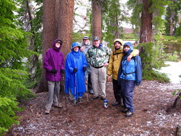 Lori, Anne, Steve, Steve, Mike, and Jen
                            gather briefly after the lightning and hail and
                            before bounding back down the mountain