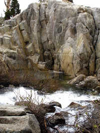 The outflow of Upper Twin Lake which
                            tunnels underground and emerges hundreds of
                            meters downhill