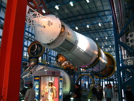 Command/Service module (actual one on
                       floor) which housed the crew. The Launch Escape
                       System (LES), the mini-rocket attached to the
                       CM with the scaffolding, could whisk the CM to
                       safety in case of mishap. On the way to the
                       moon, the CSM would detach, turn around, and
                       extract the Lunar Module (LM) from the conical
                       section. 
