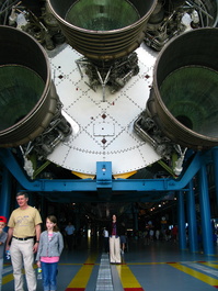 Lori is dwarfed by the base of the Saturn
                       5