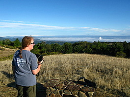 Deb takes in the fog blanketing the valley