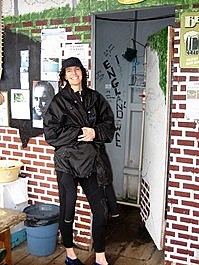 Lori smiles bravely before entering the lavatory