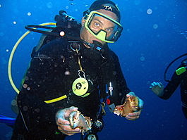 Ted shows off the claws of a crab. Deceased. Bereft of life.