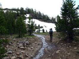 David and Lori tromp through the trail wet from the snow melt