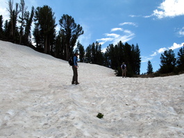 Lori tromps through the snow and hopes David knows where the trail is