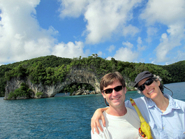 Bill, Lori, and rubber chicken pose in front of the famous Natural Arch (Photo by John Schwind)