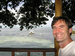 Bill on the Okemii Deli patio with the reef in the background