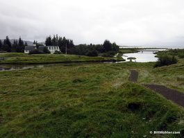 A church overlooks the stream from the Thingvellir lake