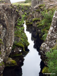 The clear blue waters below the bridge