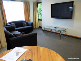 The living room with an exit to the balcony which is too cold and wet to enjoy