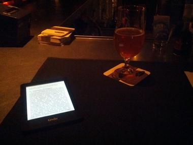 Enjoying a lambic with my reading
