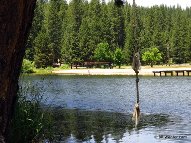 A lake in Long Barn, a rope swing, and Lori in the shade on the beach