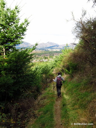 Edith hikes down the narrow bike track