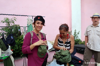 Our guide Bianca and Dale try on hats at a local crafts market