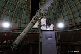 Andy operates the ship wheels to point the telescope