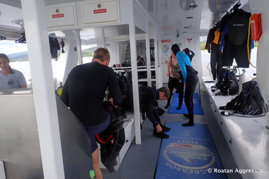 Gearing up for the next dive (photo by Roatan Aggressor)