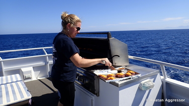 Janna barbecues (photo by Roatan Aggressor)