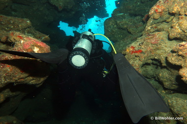 Lori swims through a narrow crack