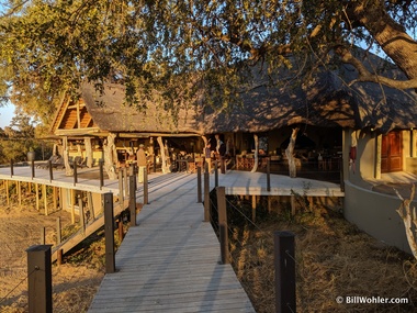 The main Kambaku lodge, where we ate on the deck, on the sand (left), and by the fire pit (right)