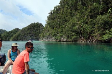 Egoi and Bonnie stare into the clear waters of the lagoon