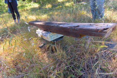 A beam, a block with math, and a swivel chair