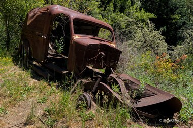 State Certified Facts, 1999, James Chinneck, Bronze, redwood, https://djerassi.org/sculptures/state-certified-facts/. But there are bullet holes!