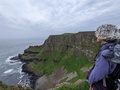 Lori soaks in the dramatic coastline of the Giant's Causeway