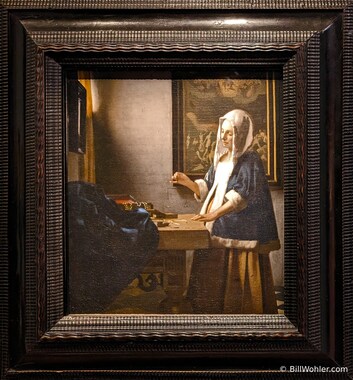 Woman Holding a Balance by Johannes Vermeer, 1662-1663