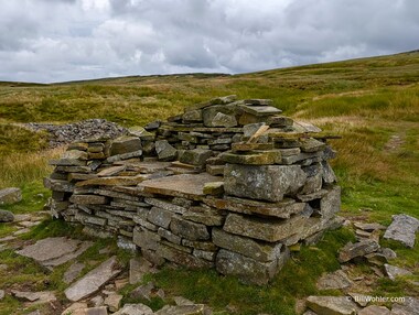 Tony says, "If you're working a fell runner race and you have to hang out, why not built a couch from rock?"