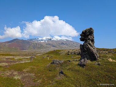 A smoke-breathing troll guards the trail through the Dritvik lava fields