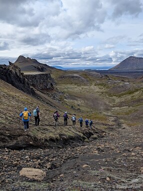 The group descends from a ridge