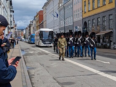 The daily march of the Danish Royal Guard from Rosenborg Castle to Amalienborg Palace completely stops city traffic, but no one seems to mind.