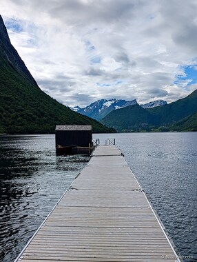 The sauna at the end of the dock with a natural cold plunge
