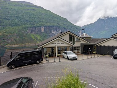 Lori in front of the Grande Fjord Hotel in Geiranger
